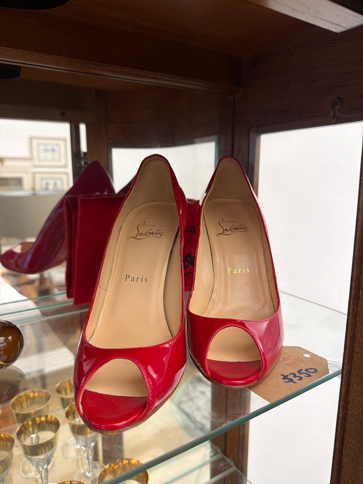 Christian Louboutin, size 38.