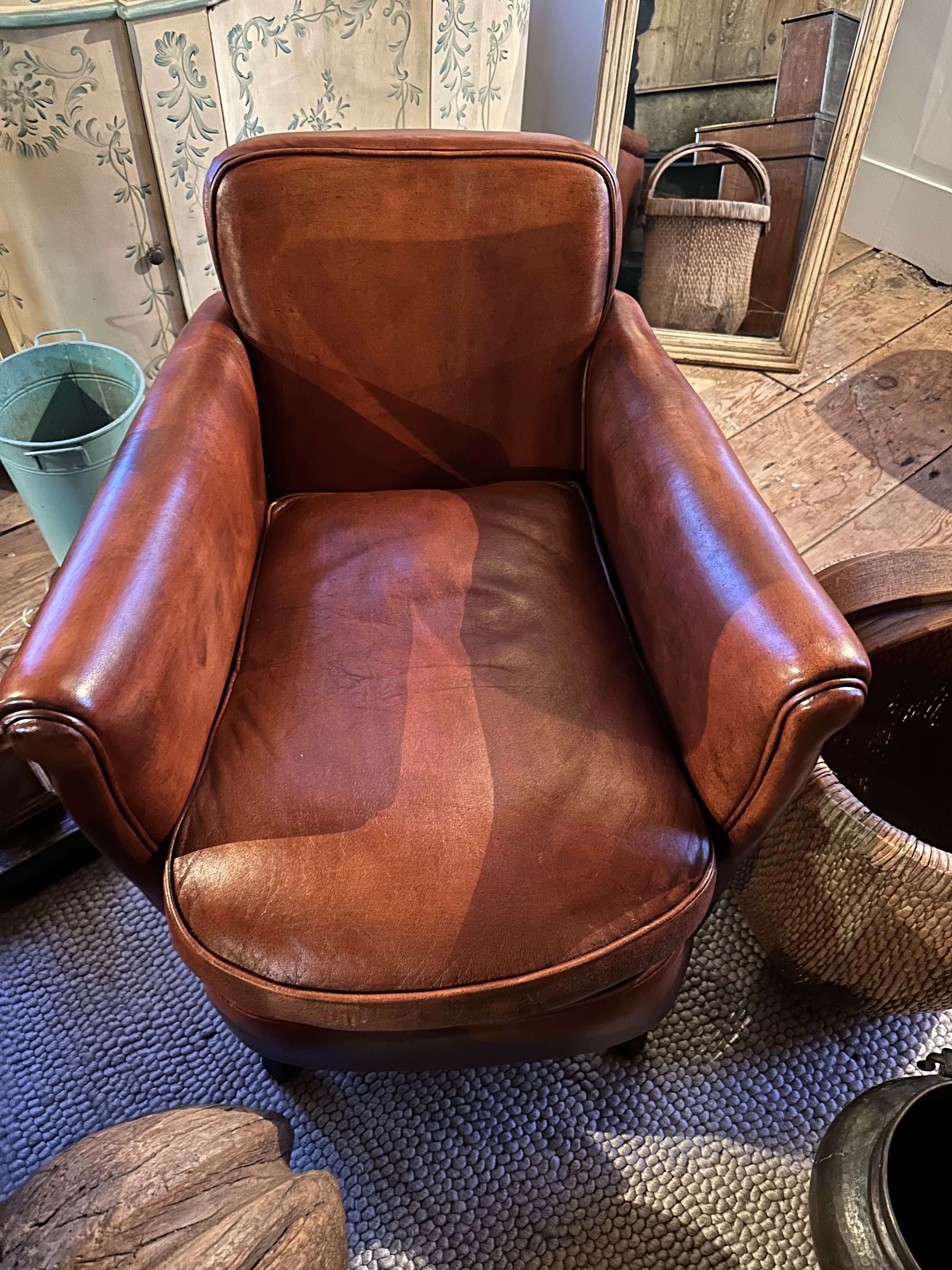 Pair of vintage leather arm chairs