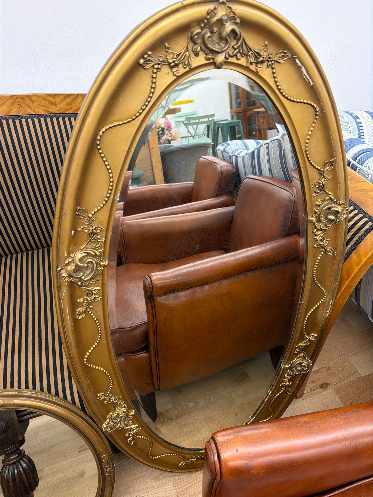 Decorative gilt finish oval mirror