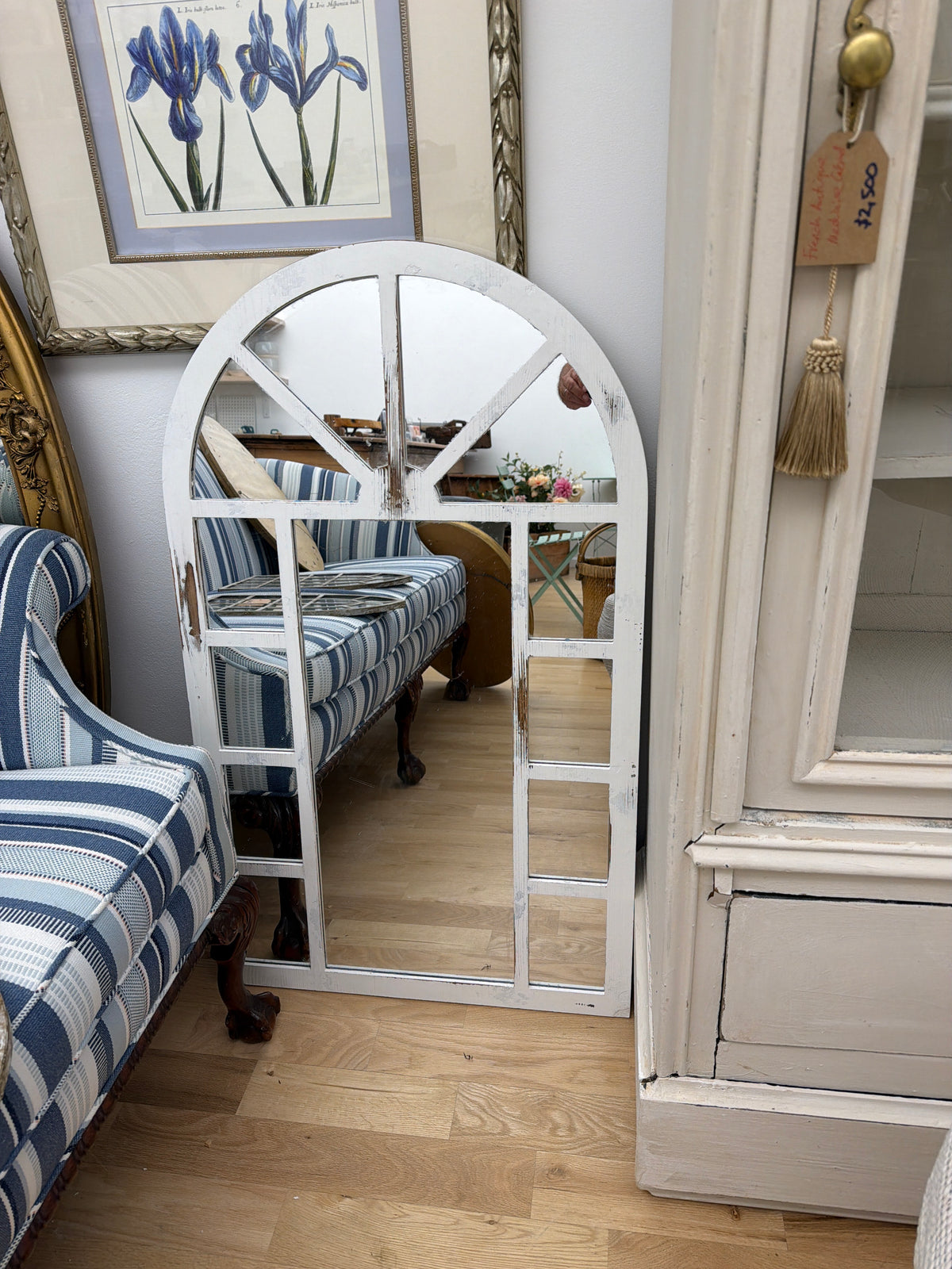 Arch shaped distressed white mirror