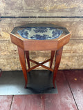 Commode Table with blue porcelain bowl under glass