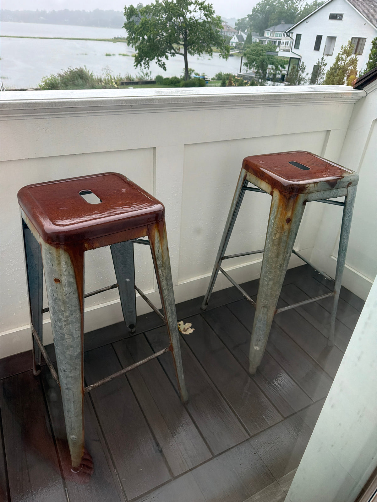 Pair of aged grey metal stools with lovely rust patina