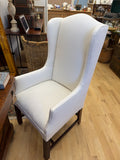 Queen Anne style wing chair re-covered in white linen