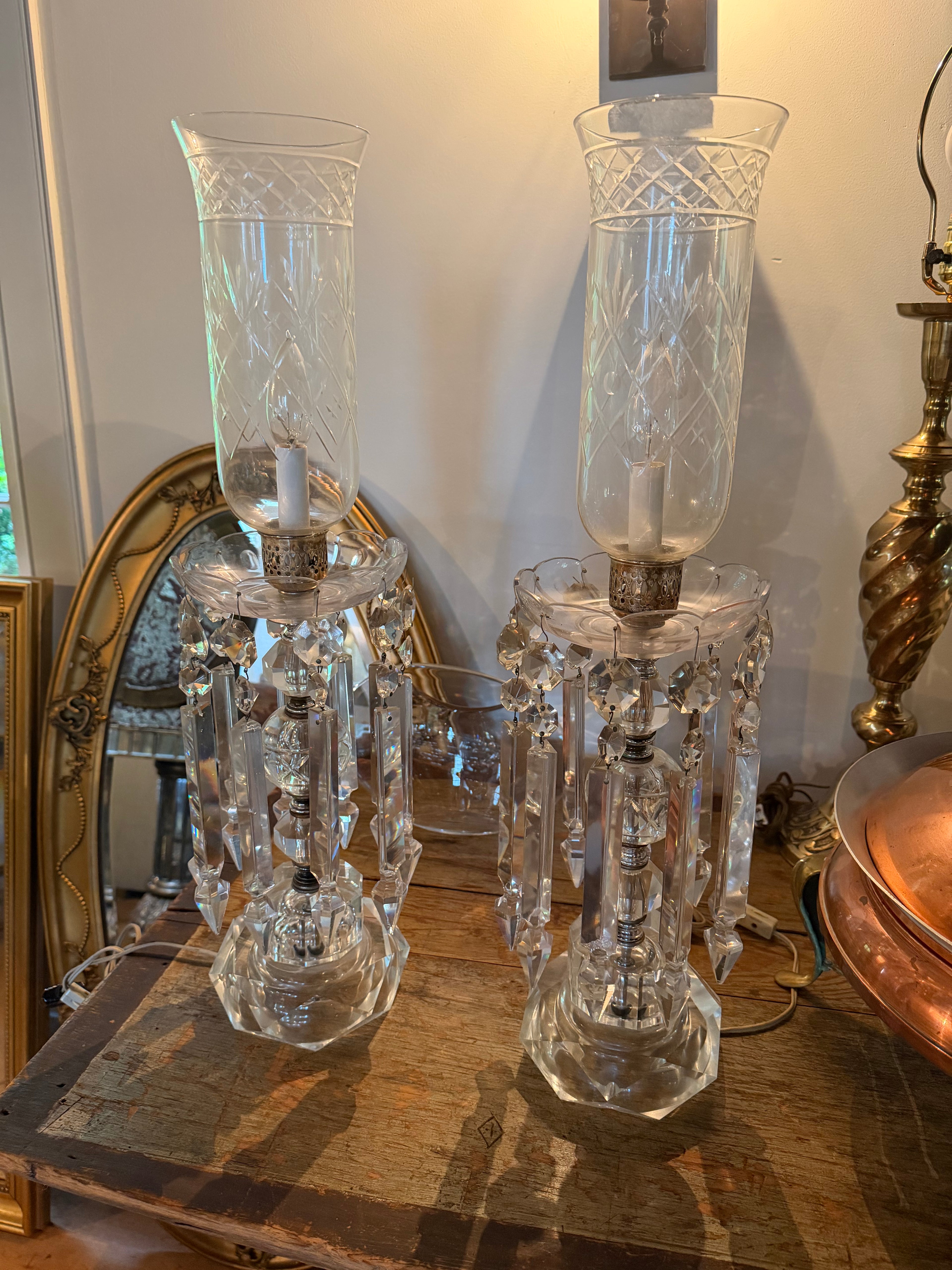 Pair of Hollywood regency cut crystal and etched glass hurricane table lamps
