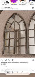 Pair of small white metallic mirrors.